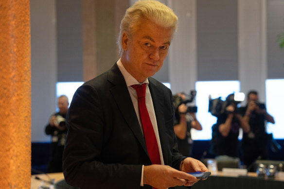 Geert Wilders, Dutch right-wing politician and leader of the Party for Freedom (PVV), checks his phone during negotiations to form a coalition.