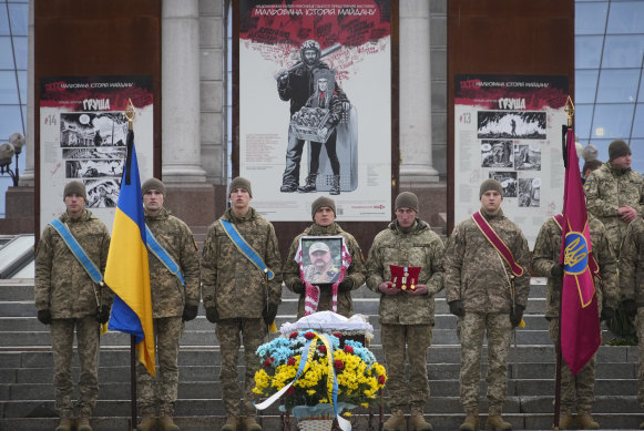Ukrainian servicemen at a Sunday commemoration for a comrade killed in battle with Russian forces in the Donetsk region.