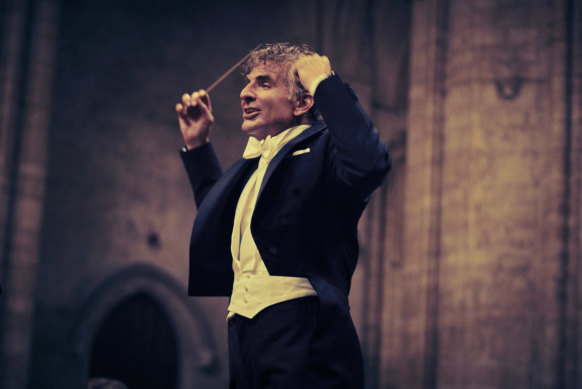 Bradley Cooper stars as legedary conductor-composer Leonard Bernstein in <i>Maestro</i>.