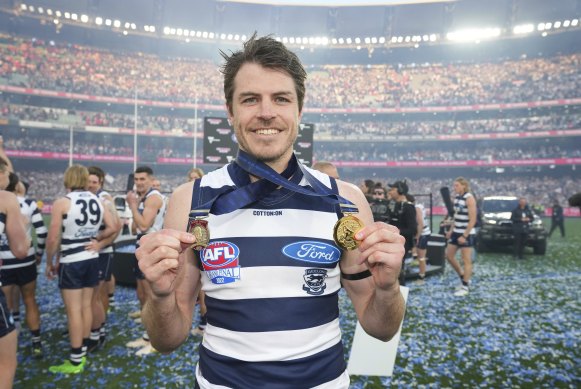 Isaac Smith with the Norm Smith Medal and his fourth premiership medal.