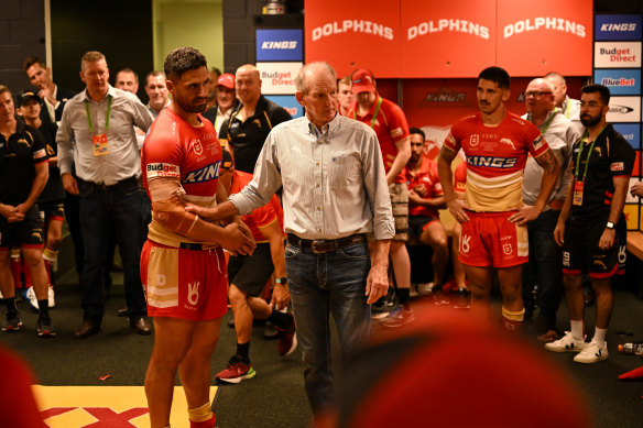 Wayne Bennett addresses his players in the sheds after the round one win over the Roosters.