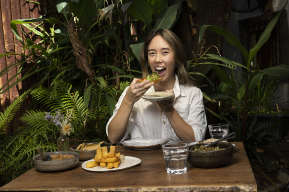 Journalist Laura Chung tries avocado toast sprinkled with cricket salt and black ants. 