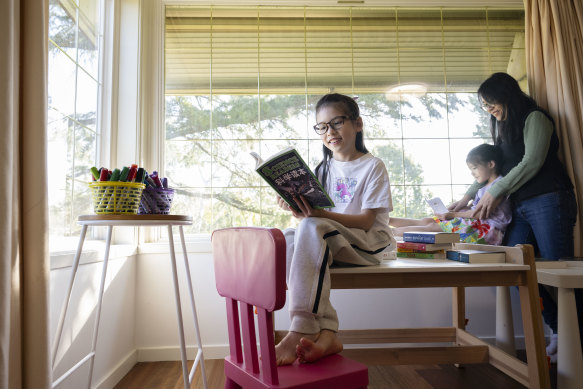 Year 4 student Alice Ou, 8, seen with her sister Erica, 5, and mother, Jessica Li, will sit for the OC placement test in August.