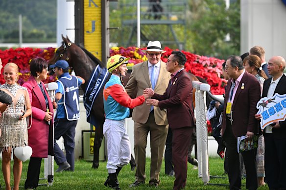 Owner Leung Shek-kong (right) celebrates a Ka Ying Rising win with jockey Zac Purton and trainer David Hayes