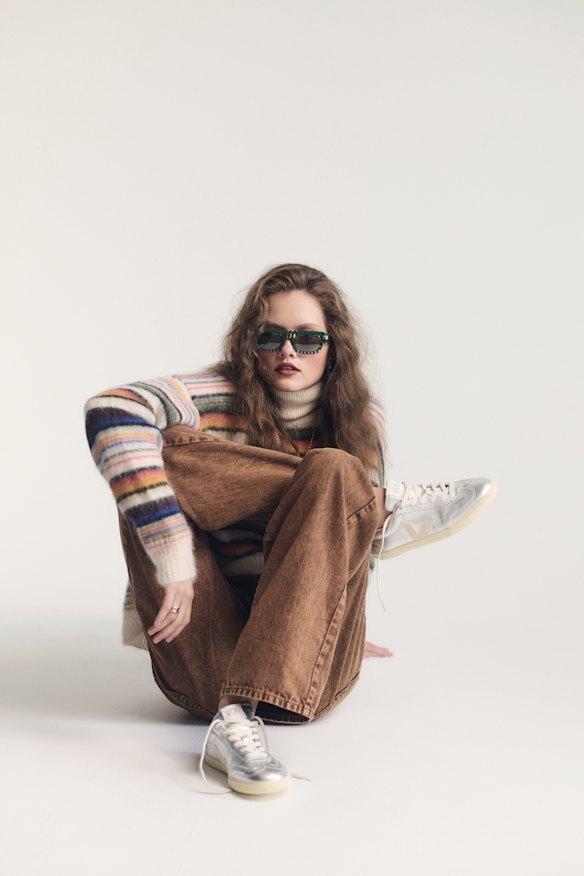Isabel Marant Etoile “Mobyli” sweater, $559, from David Jones. Bassike jeans, $495. Bottega Veneta sunglasses, $815.  Noah the Label “Aura” ring, $79 (worn throughout). Veja “Volley” trainers, $220 (worn throughout).