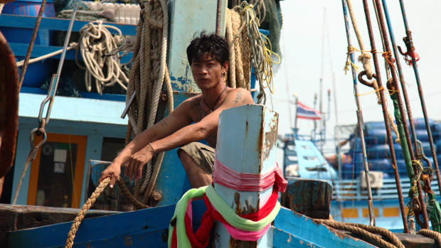 A fisherman arriving in port in Pattani, Thailand.
