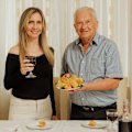 Jessica Timpano and her nonno, Bart Nicoliello, enjoy home-made croquettes and wine.