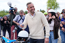Ulrich Siegmund, top candidate for the “Alternative for Germany” (AfD) party holds his motorcycle keys in party colors after voting at a polling station during the Saxony-Anhalt state elections.