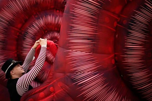 A circus performer prepares for Karandash-Fest, a street festival of circus performers in Staritsa, Tver region, Russia.