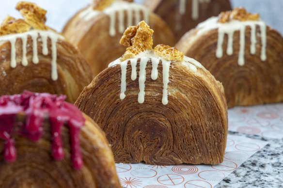 Mixed berry and custard half-moon (front left) and salted caramel half-moon pastries.