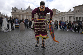 An Indigenous artist from Canada performs in St Peter’s Square, at the Vatican, on Friday.