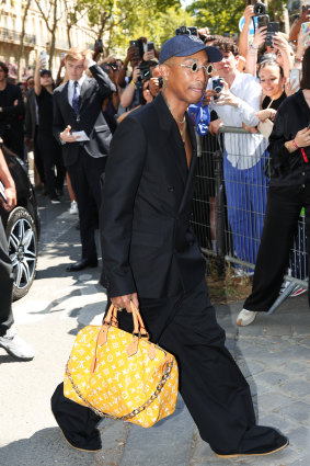 Pharrell Williams with Louis Vuitton’s new “Millionaire Speedy” bag that costs … $US1 million.