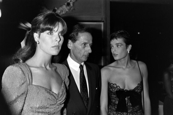 Princess Caroline of Monaco (left), Marc Bohan, and Princess Stephanie of Monaco attend an event at Le Palace in Paris in 1984.