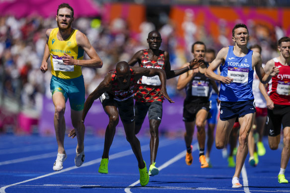 Oliver Hoare, left, of Australia crosses the finish line to win the men's 1500 meter final. 