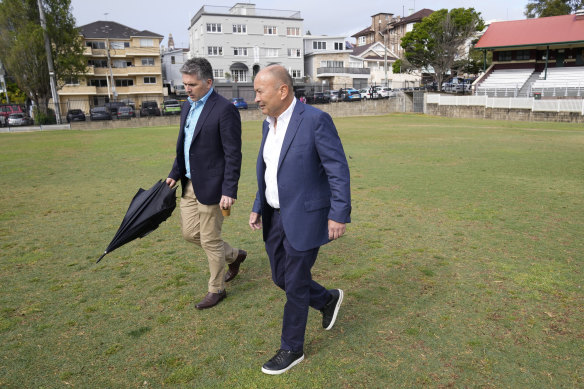 Eddie Jones on his old Coogee Oval stomping ground with Rugby Australia’s head of communications, Mark McCartney.