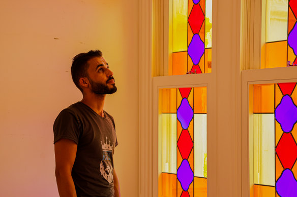 Sursock Museum employee Malek Al Steyfll inspects the building’s newly replaced stained glass windows. 