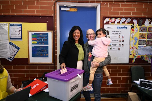 Greens candidate for the seat of Wills Samantha Ratnam casts vote in Brunswick East with her partner, Colin Jacobs, and daughter Malala.
