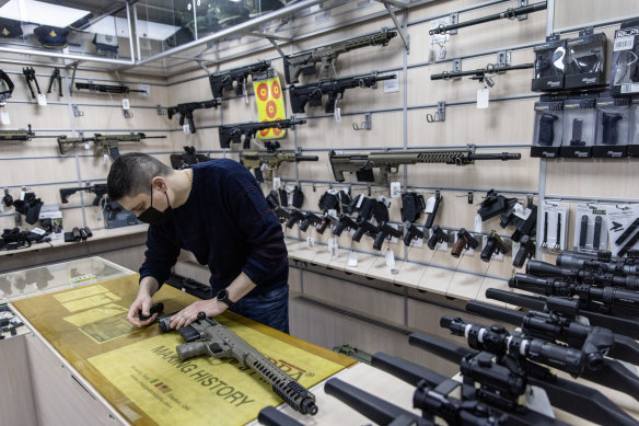 An employee works at a gun shop in Kyiv, Ukraine. 