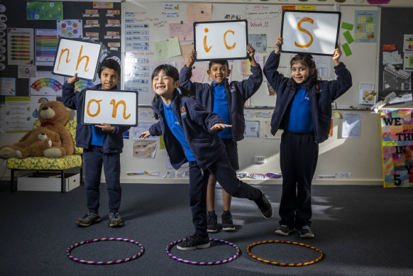 Wheelers Hill Primary School pupils (from left) Adam, Clara, Akein and Hasti, all aged 7, play a spelling game that uses hula-hoops.