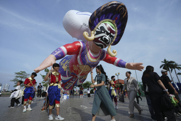 A giant balloon flies outside the Royal Palace in Phnom Penh, Cambodia ahead of New Year’s Eve celebrations.