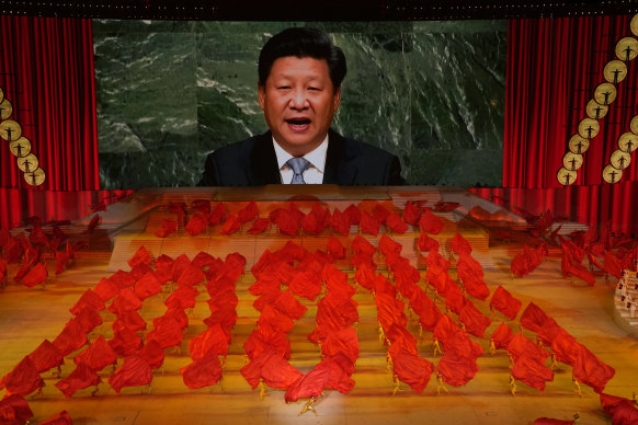 Chinese President Xi Jinping is displayed on a screen as performers dance at a gala show ahead of the 100th anniversary of the Chinese Communist Party in 2021. Xi wants other performers to align themselves more with the CPP.