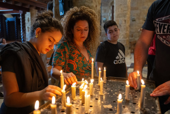 Members of the Maronite Christian community pray after being told to remain in place by their priest following an Israeli Defence Force notice to evacuate the village in Klayaa, Lebanon.