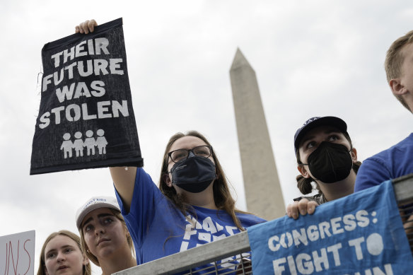 Demonstrators attend a March for Our Lives rally against gun violence on the National Mall in June in DC.