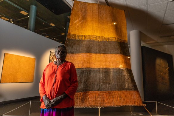 NATSIAA winner and senior Yolngu artist Margaret Rarru Garrawurra with her winning art work Dhomala (pandanas sail).