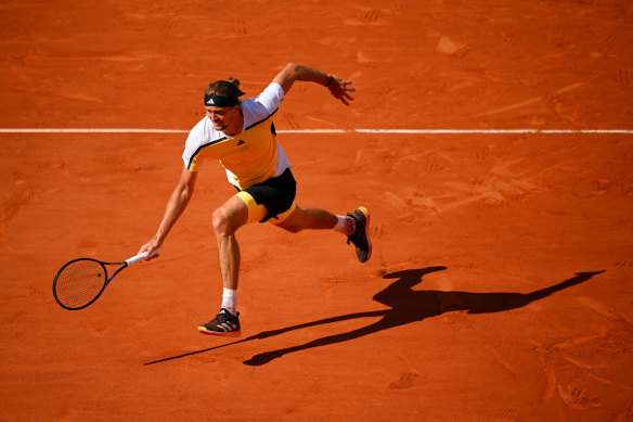 Alexander Zverev chases down the ball before playing a forehand.