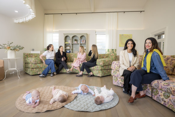 Keshia Hutchens (front left) and Ariel Bryant (front right), founders of From Day One in Melbourne, with members of one of their mother’s groups.