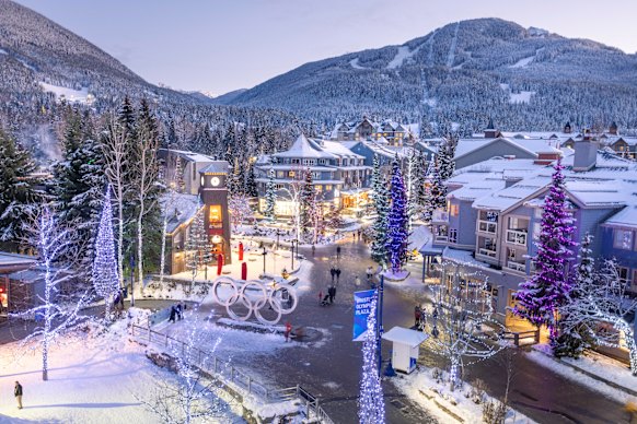 The village and mountains and Olympic Plaza mountains at night (Whistler was a host resort for the 2010 Winter Olympics).
