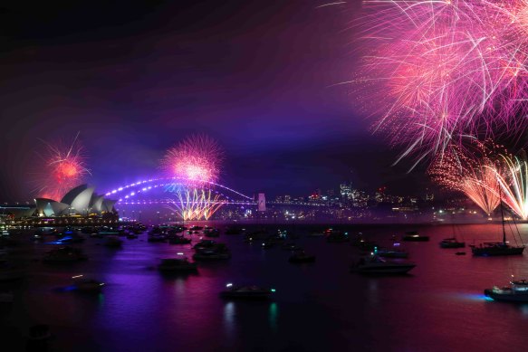 Fireworks light up the skies above Sydney Harbour at 9pm on New Year’s Eve.