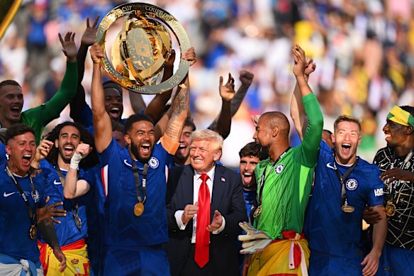 Chelsea players lift the World Club Cup trophy alongside Donald Trump.