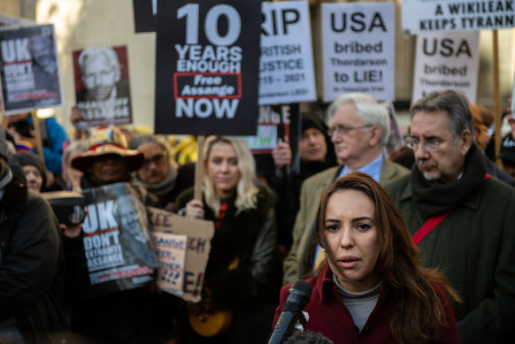 Stella Morris, partner of Julian Assange, speaks to the press outside the Royal Courts of Justice following the hearing on Friday.