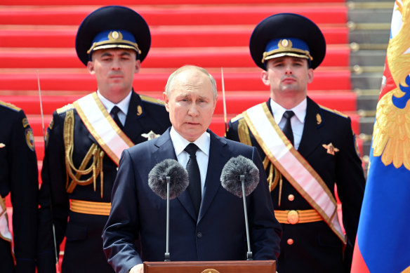 Russian President Vladimir Putin addresses members of Russian military units, the National Guard and security services in Cathedral Square at the Kremlin.