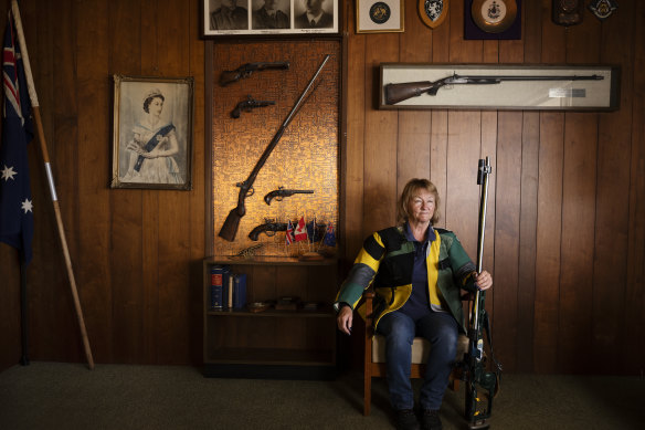 A youthful Queen Elizabeth hangs above long distance rifle shooter Barbara Schwebel at the ANZAC Rifle Range chairman’s room at Malabar.
