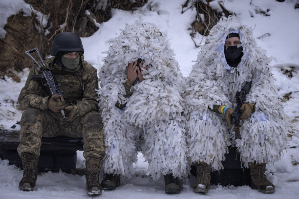 Members of the pro-Ukrainian Russian ethnic Siberian Battalion rest at a military training close to Kyiv, Ukraine, on Wednesday.