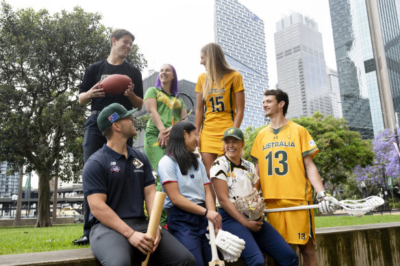 Athletes pose for the cameras after flag football, baseball, squash, cricket, softball and lacrosse were added to the Games schedule for 2028.