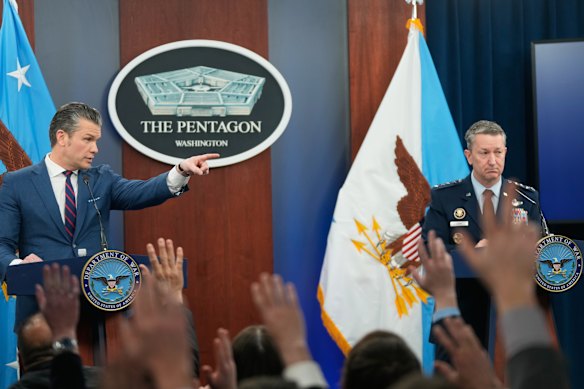 Pete Hegseth, left, at a March 2 Pentagon briefing on the war. 