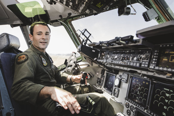 RAAF Flying Office Conor O'Neill at the controls in the huge C17A Globemaster at Canberra Airport open day.