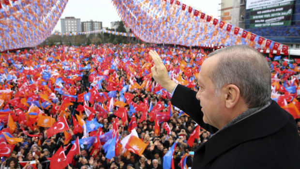 Turkey's President Recep Tayyip Erdogan waves as he addresses his supporters during a rally in Kocaeli, Turkey, on Saturday.