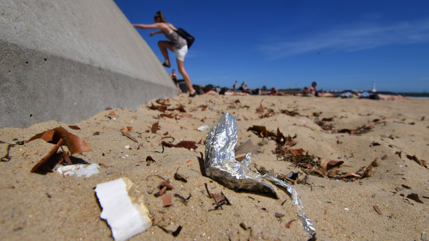 Rubbish on the sand at St Kilda beach.