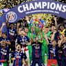 PSG players celebrate with the trophy after winning the Champions League final in Budapest.