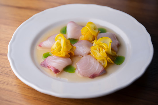 Hiramasa kingfish crudo with white soy, yuzu, ginger and rice vinegar dressing.