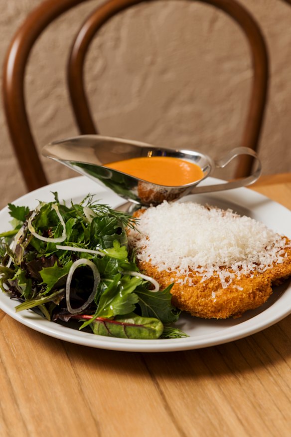 Chicken schnitzel with parmesan and vodka-tomato sauce.