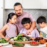 Adam Liaw cooking with his kids.