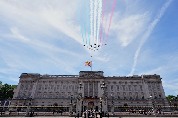 Plane of the Royal Air Force perform a flypast over Buckingham Palace