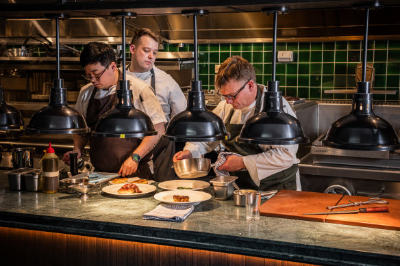 Chefs on the pass of the pub’s new open kitchen.