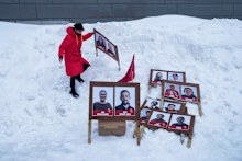 A woman arranges campaign posters in Nuuk, Greenland.