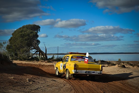 A trek car passes Lake Tyrrell in Victoria.